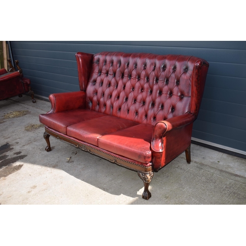 506 - Queen Anne revival chesterfield wingback three seater sofa, with high back, in red leather with butt... 