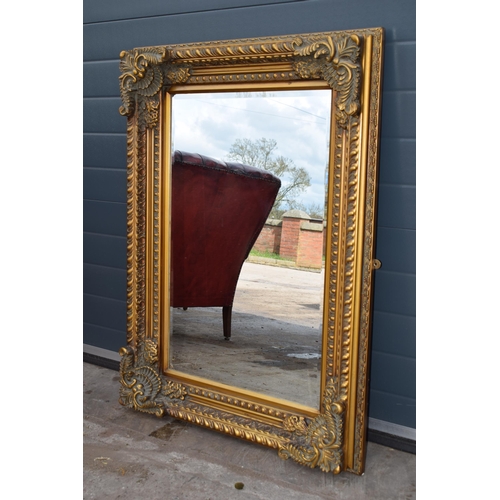 508 - Quality reproduction ornate gilt rectangular mirror with bevel edged glass, 120x89cm.