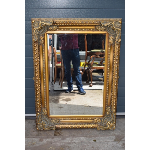 508 - Quality reproduction ornate gilt rectangular mirror with bevel edged glass, 120x89cm.