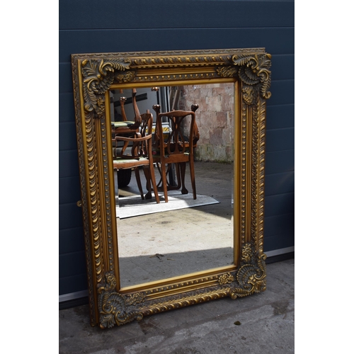 508 - Quality reproduction ornate gilt rectangular mirror with bevel edged glass, 120x89cm.