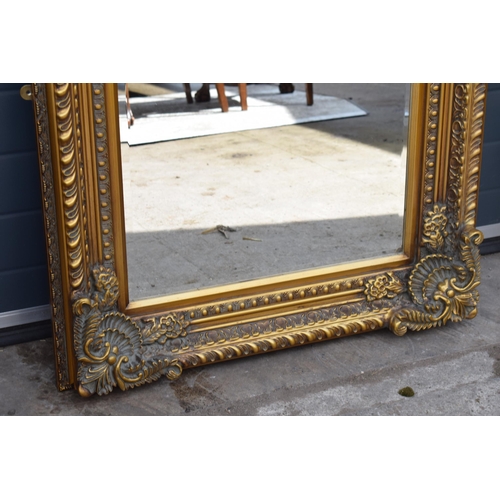 508 - Quality reproduction ornate gilt rectangular mirror with bevel edged glass, 120x89cm.