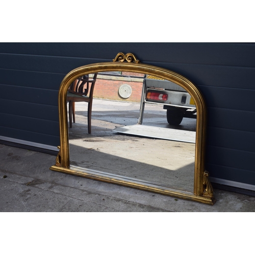 509 - Reproduction gilt over mantle mirror, 119x89cm, with finial.