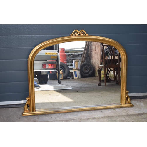 509 - Reproduction gilt over mantle mirror, 119x89cm, with finial.