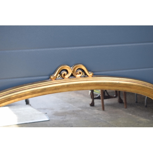 509 - Reproduction gilt over mantle mirror, 119x89cm, with finial.