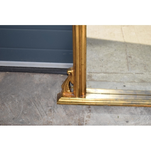 509 - Reproduction gilt over mantle mirror, 119x89cm, with finial.