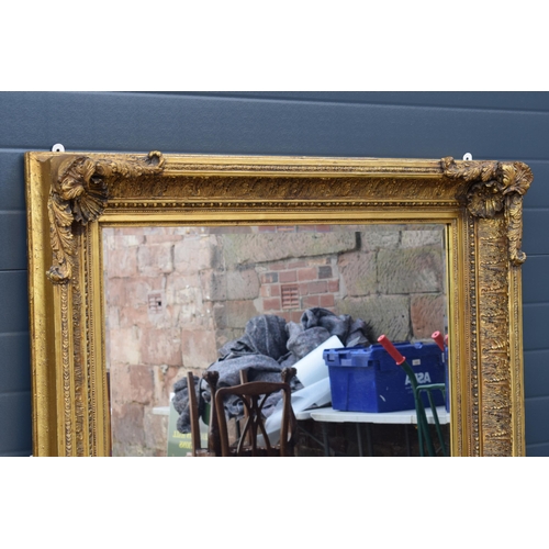 510 - Quality reproduction gilded rectangular mirror, with bevel edged plate, in ornate composite gilded f... 