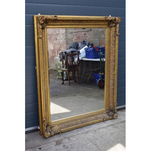 510 - Quality reproduction gilded rectangular mirror, with bevel edged plate, in ornate composite gilded f... 