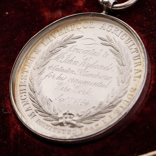 177 - Cased 'Liverpool and Manchester Agricultural Society' medallion, dated 8th September 1854, in white ... 