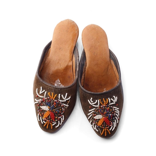 267 - A pair of Russian hand embroidered shoes with overlaid decoration, 25cm long.