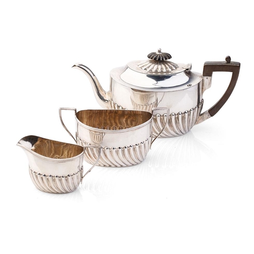 291 - Hallmarked silver tea set to include a teapot, milk and sugar bowl, 388.0 grams / 12.48 oz gross wei... 