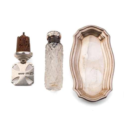 309 - A trio of silver items to include a silver shaped dish, 10cm long, 23.8 grams, a silver topped cut g... 