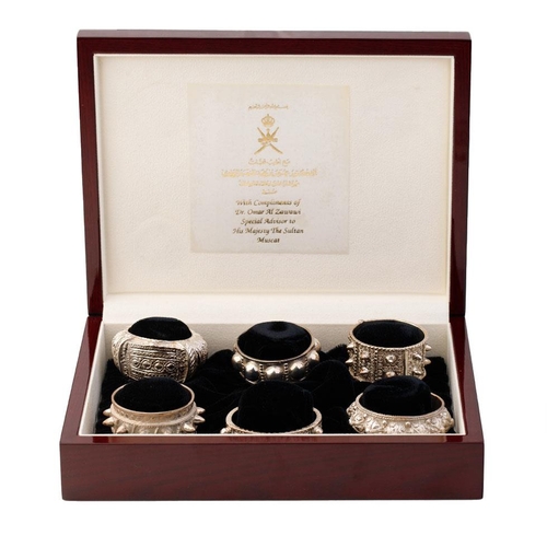 Jawahir Oman a set of 6 sterling silver napkin rings in the form of
