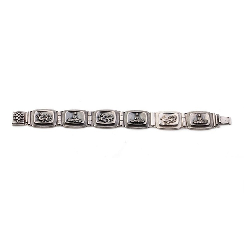 390 - 935 silver Chinese export silver panel link bracelet with dragon motifs, 33.7 grams, 20.5cm long.