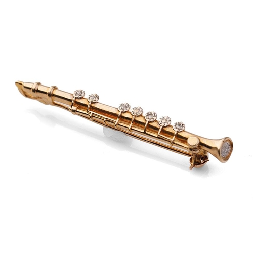 397 - 9ct gold diamond set bar brooch in the form of a clarinet, 2.5 grams, 4.5cm wide.