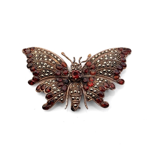 407 - Large sterling silver and marcasite articulated butterfly brooch set with garnets, 24.1 grams, 7cm w... 