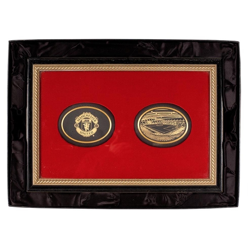 Manchester United Football Club interest: a rather unusual boxed Wedgwood Jasperware in Black presentation set in gilt rope effect frame with red velvet background, one plaque with the Man United logo in gilt with a gilt decorated plaque with Old Trafford, plaques 16cm long, frame 37x54cm.

Provenance: the vendor believes that this is 1 of 2 produced. Supposedly, the other was given to Sir Alex Ferguson and the other was gifted to a relation of the vendors by a well respected employee of Wedgwood. The employee thought they were being very kind in gifting this to their friend until they realised he supported Manchester City and not United. It has been stored away for some years until now when it is being offered for auction.