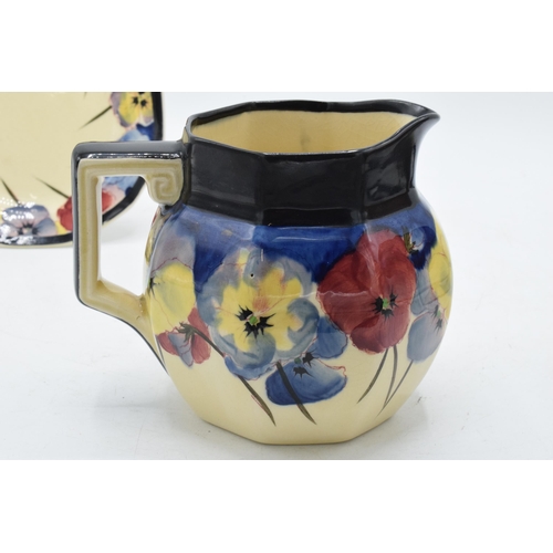 120 - Royal Doulton 'Pansy' pattern milk jug and shaped edge side plate, 14cm diameter (2).