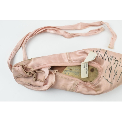 173 - Alexandra Danilova: a 1940s pink ballet pointe shoe, signed by Danilova 'To Cliff A. Danilova 1941',... 