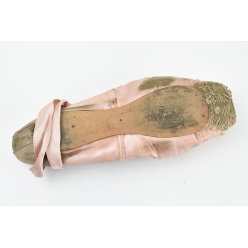 173 - Alexandra Danilova: a 1940s pink ballet pointe shoe, signed by Danilova 'To Cliff A. Danilova 1941',... 