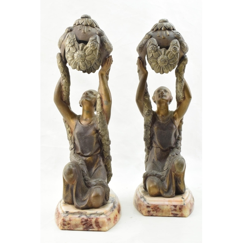 253 - A pair of French Art Deco spelter figures in the form of Joan of Arc, inspired by La Belle, mounted ... 