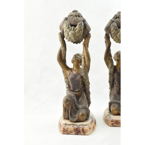 253 - A pair of French Art Deco spelter figures in the form of Joan of Arc, inspired by La Belle, mounted ... 