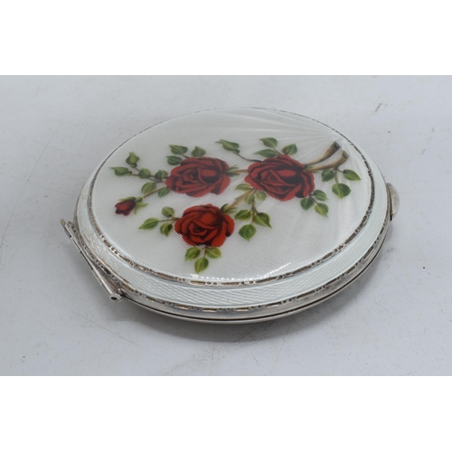 287 - Silver and enamel compact, circular form rose decoration, engineered decoration to underside, Walker... 