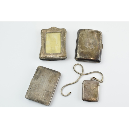 289 - Silver items to include a vesta case Chester 1915, 2 cigarette cases, silver weight 161.0 grams, a s... 