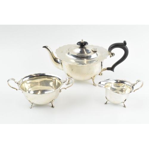 290 - Hallmarked silver tea set to include a teapot, milk and sugar with ebonised wooden handle and finial... 