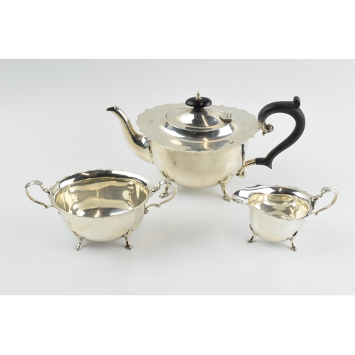 290 - Hallmarked silver tea set to include a teapot, milk and sugar with ebonised wooden handle and finial... 