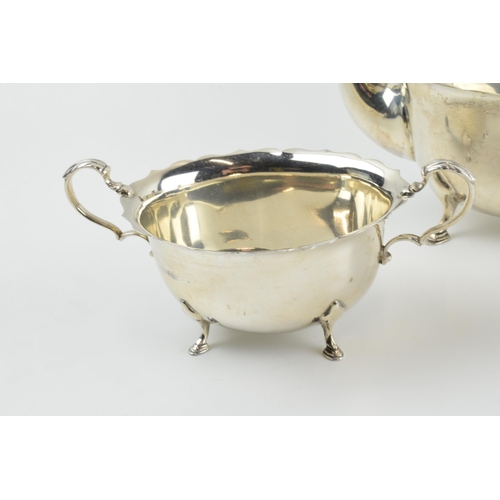 290 - Hallmarked silver tea set to include a teapot, milk and sugar with ebonised wooden handle and finial... 