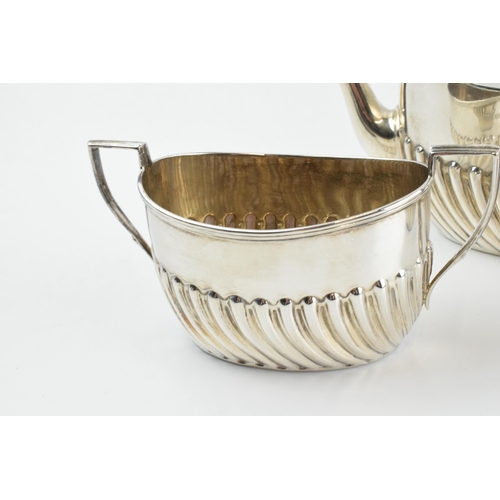 291 - Hallmarked silver tea set to include a teapot, milk and sugar bowl, 388.0 grams / 12.48 oz gross wei... 