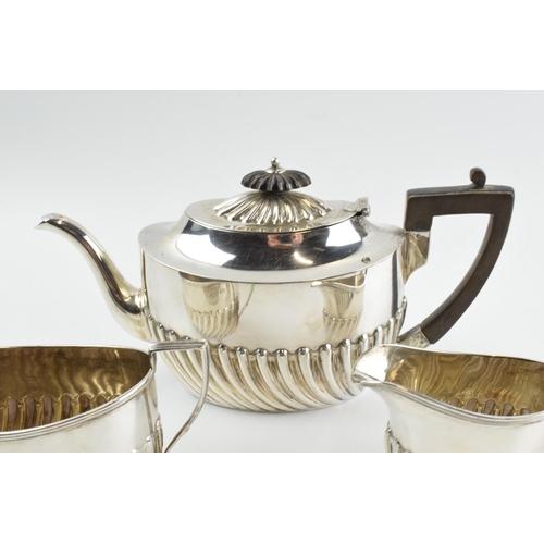 291 - Hallmarked silver tea set to include a teapot, milk and sugar bowl, 388.0 grams / 12.48 oz gross wei... 