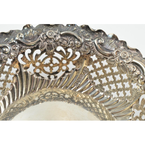 295 - Hallmarked silver ornate pierced bonbon dish, 58.2 grams / 1.87 oz, 11.5cm diameter, Sheffield 1894.