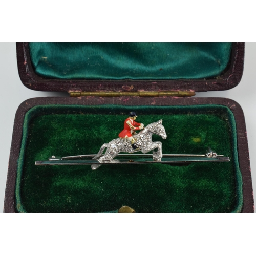 371 - 18ct white gold bar brooch with 18ct gold huntsman with enamelled decoration, set with old cut diamo... 