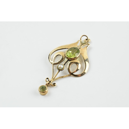 379 - Edwardian 9ct gold pendant set with peridot stones,  1.6 grams, 4cm long.