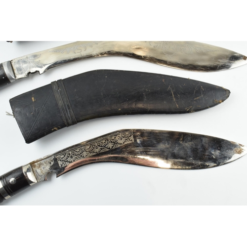 449 - 20th century Gurkha style Kukri knife in black leather scabbard together with smaller example (2),  ... 