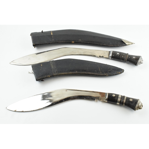 449 - 20th century Gurkha style Kukri knife in black leather scabbard together with smaller example (2),  ... 