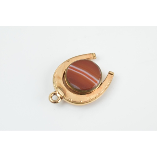 465 - Gold plated horseshoe watch fob with agate face and compass, 3.5cm long.