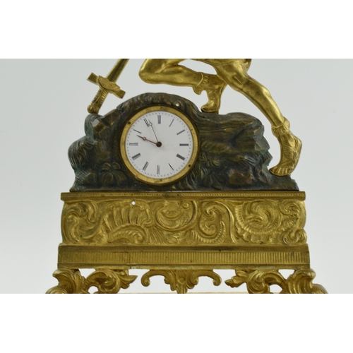 497 - 19th century continental gilt metal mantle clock of a soldier falling onto his own sword, on ebonise... 