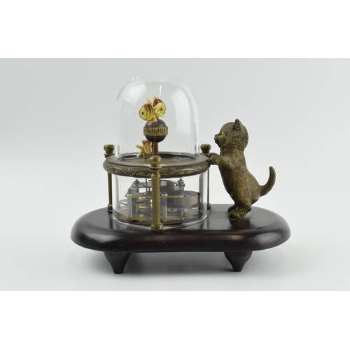 498 - Good quality reproduction novelty clock in the form of a cat watching fish under a glass dome, in wo... 