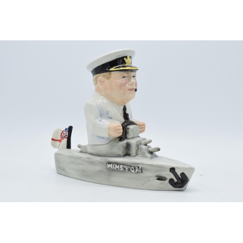 76 - Bairstow Manor Collectables comical model of Winston Churchill in a boat, 18cm tall.