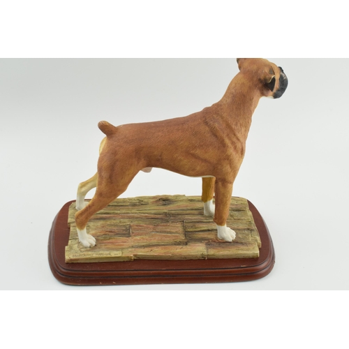 100 - Border Fine Arts Margaret Turner standing boxer dog, on wooden base, 31cm long.