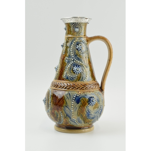 125 - Doulton Lambeth stoneware jug, 1874, of baluster form with white metal mount, signed Emily J Edwards... 