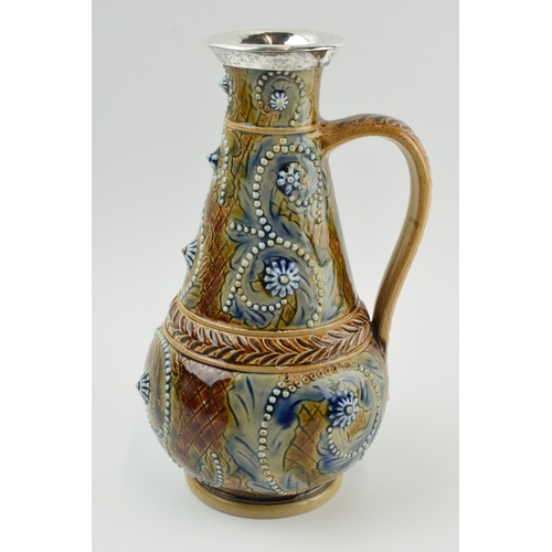 125 - Doulton Lambeth stoneware jug, 1874, of baluster form with white metal mount, signed Emily J Edwards... 