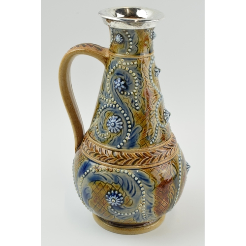 125 - Doulton Lambeth stoneware jug, 1874, of baluster form with white metal mount, signed Emily J Edwards... 