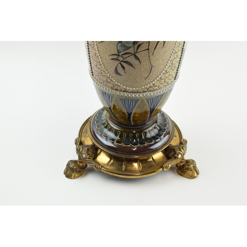 129 - Doulton Lambeth Florence Barlow stoneware oil lamp base with brass tri-leg stand in the form of hoof... 