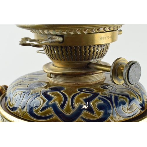 129 - Doulton Lambeth Florence Barlow stoneware oil lamp base with brass tri-leg stand in the form of hoof... 