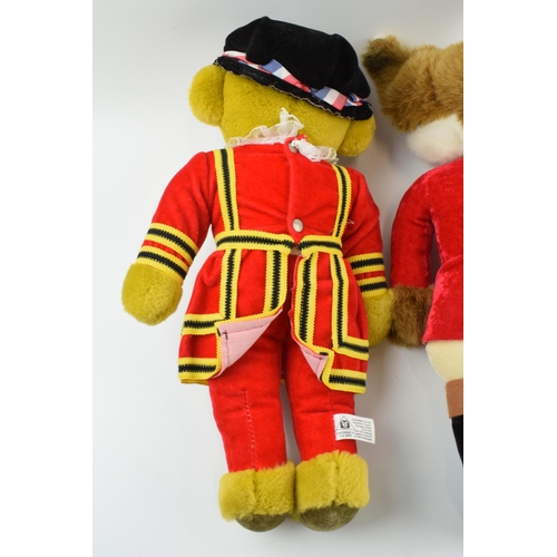 171 - A pair of Merrythought teddy bears to include a Huntsman Fox in red jacket with a Beefeater (2).