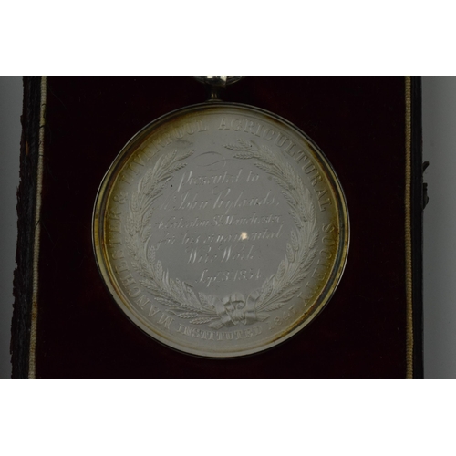 177 - Cased 'Liverpool and Manchester Agricultural Society' medallion, dated 8th September 1854, in white ... 