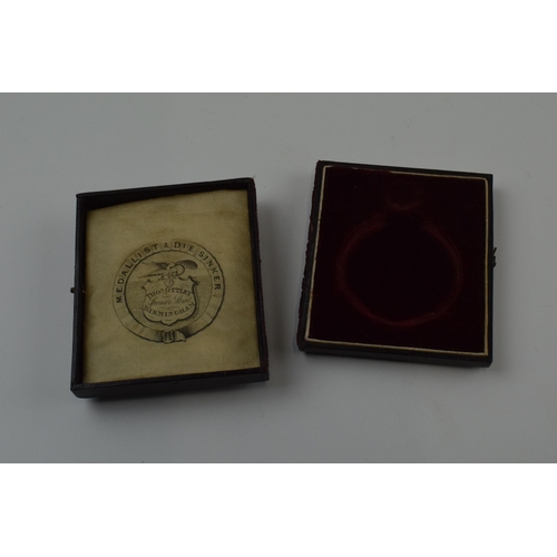 177 - Cased 'Liverpool and Manchester Agricultural Society' medallion, dated 8th September 1854, in white ... 